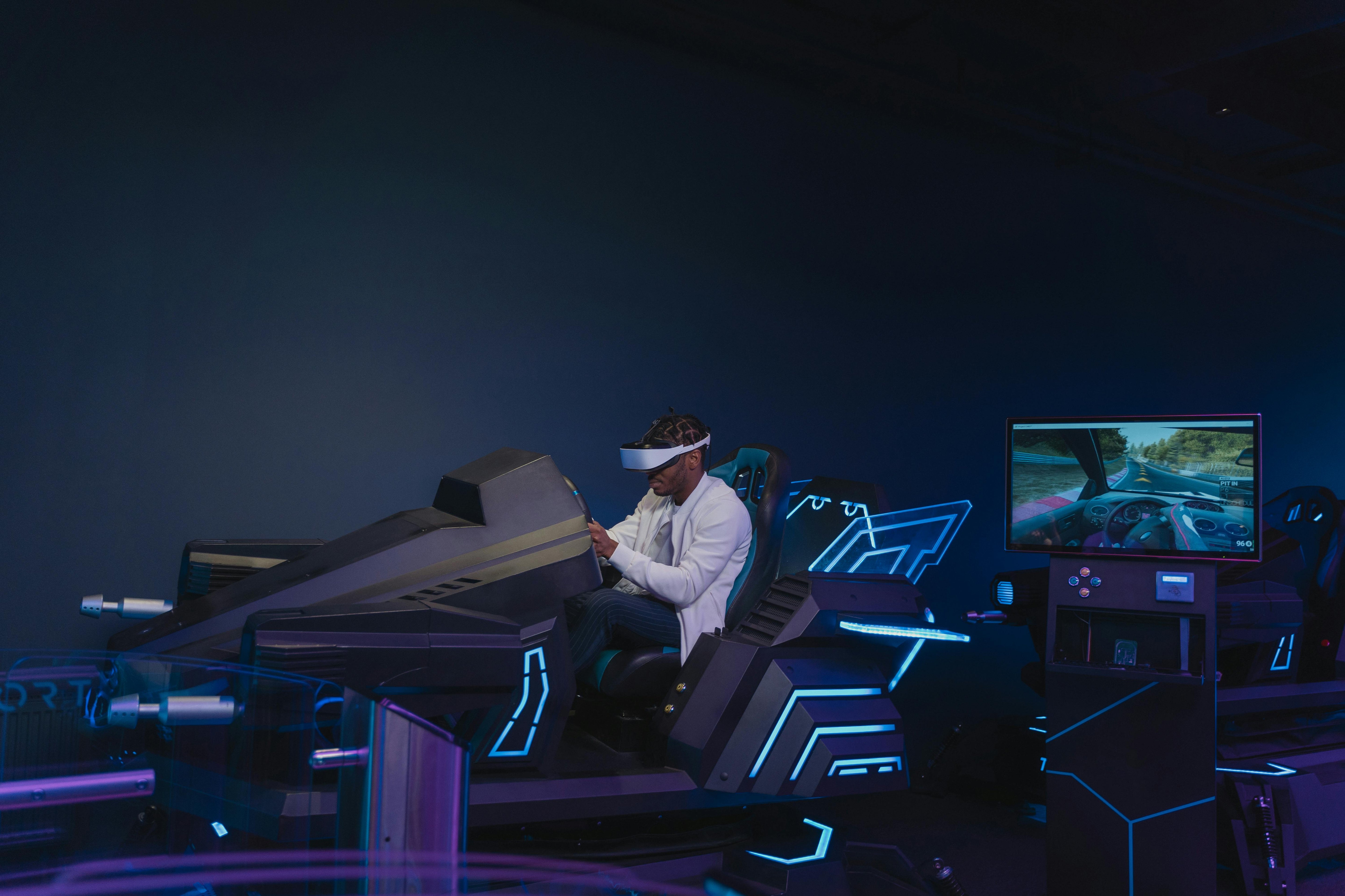 Picture showing a person playing video game in a Virtual Reality Setup.