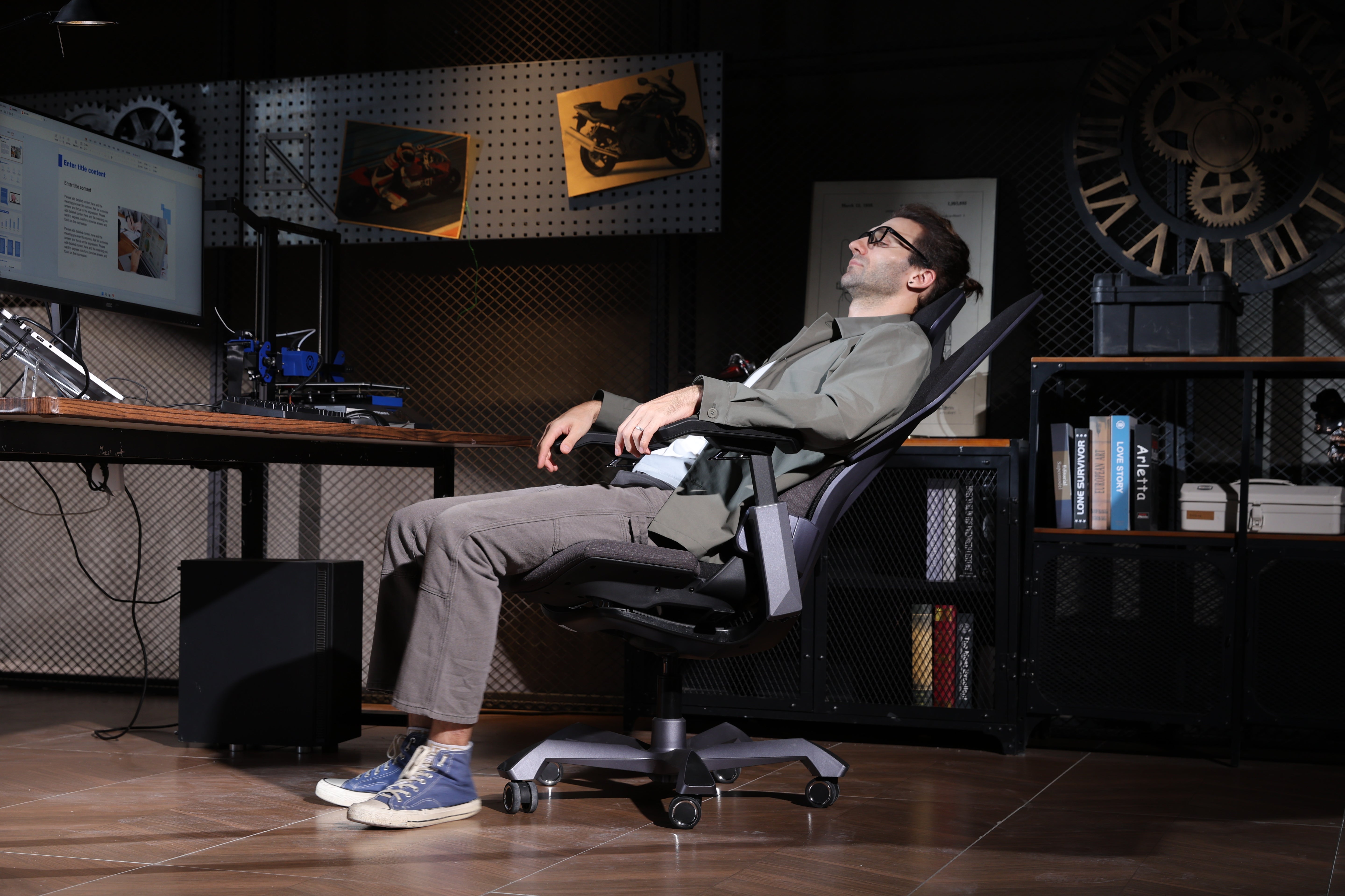 Picture showing the TGIF T0 from the side with a person sitting on it, relaxing in a lying position.